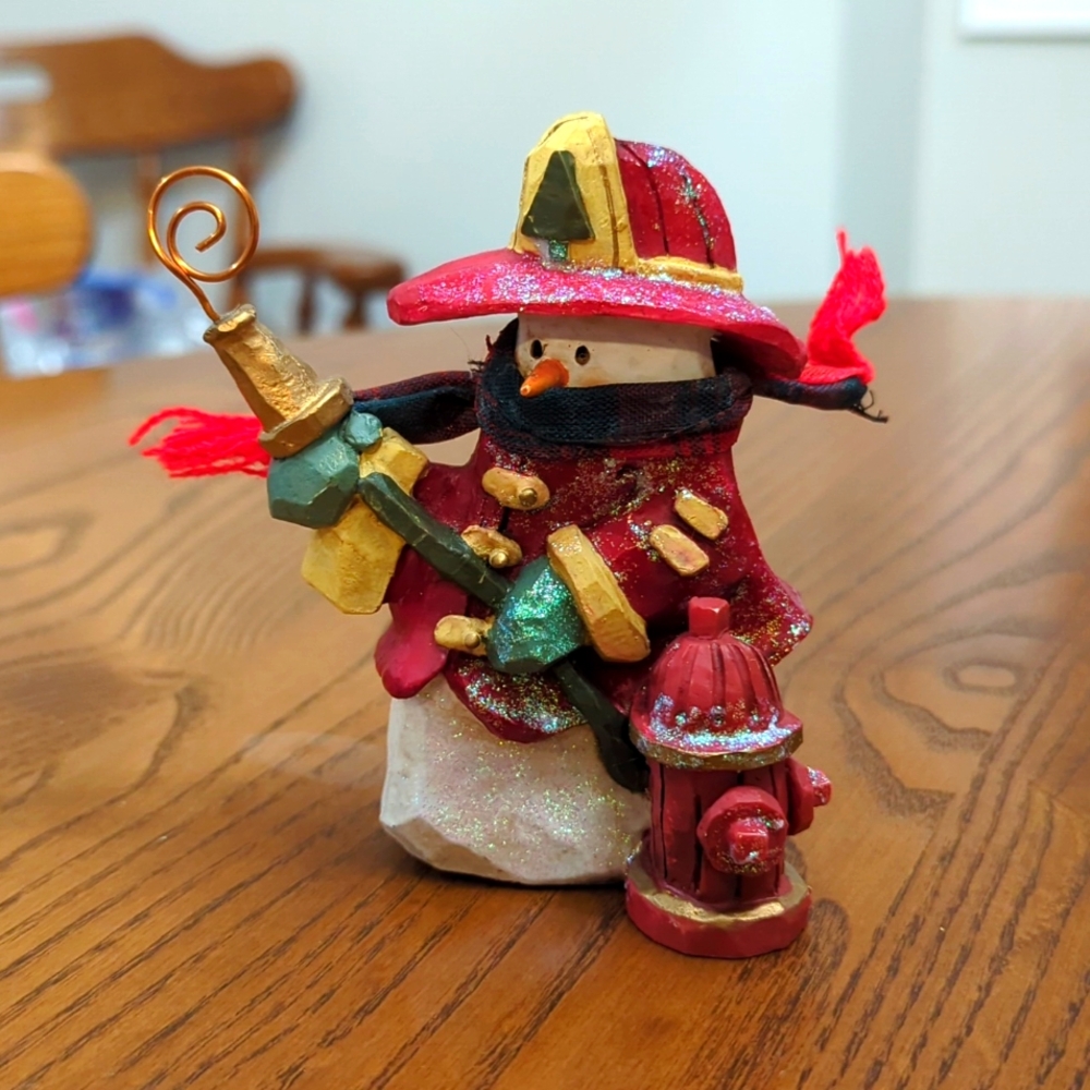 Kurt Adler snowman firefighter. Resin. Scarf. 4 inches high.